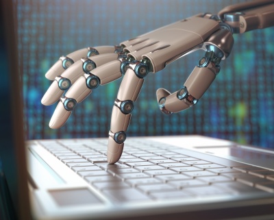 robot hand typing laptop keyboard